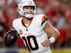 KANSAS CITY, MISSOURI - SEPTEMBER 14: Bo Nix #10 of the Denver Broncos looks to throw a pass against the Kansas City Chiefs during the second quarter in the game at Arrowhead Stadium on September 14, 2026 in Kansas City, Missouri.   Jamie Squire/Getty Images/AFP (Photo by JAMIE SQUIRE / GETTY IMAGES NORTH AMERICA / Getty Images via AFP)