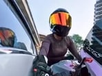 Footage appeared to show a car swerving towards Sia and hitting her motorcycle.