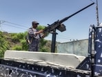 A member of the Saudi-backed Yemeni government forces, including National Army and Taiz Axis forces, mans a turret mounted on the back of a pickup truck at a checkpoint along the Kadha frontline west of Taiz in western Yemen on September 13, 2026. Flaring fighting between government forces and Iran-backed Houthi authorities in Yemen has displaced nearly 86,000 people, the United Nations said on September 13, with the number surging by 10,000 from a day earlier. (Photo by AFP)