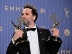 Matthew Rhys winner of the awards for Outstanding Lead Actor in a Comedy Series for "Widow's Bay" and Outstanding Lead Actor in a Limited or Anthology Series or Movie for "The Beast in Me" poses in the press room. (Photo by Frederic J. Brown / AFP)