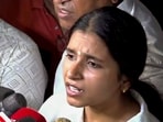 Woman biker Shivani Chauhan, who identifies herself as Sia, speaks to the media following a video surfaced on social media showing her riding a bike after a speeding car allegedly hit her(PTI)