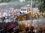 Police use water cannons to disperse Congress leaders and workers protesting against the lack of uninterrupted power supply to farmers, domestic consumers and industries, outside the headquarters of the power utility, Punjab State Power Corporation Limited, in Patiala on Monday. (PTI)