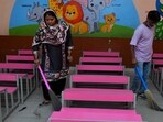 Sweepers cleaning the premises of a govt school in Ludhiana on Monday. (HT Photo)