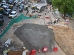 Workers are filling the cavity in layers with soil and substrate, compacting each layer to strengthen the road before laying bitumen. (PARVEEN KUMAR/HINDUSTAN TIMES)