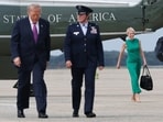 President Donald Trump seen with Natalie Harp.(Getty Images via AFP)