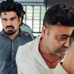 Dausa [Rajasthan], Sep 15 (ANI): The accused driver, Kalyan Bainsla (L), arrested by the Gurugram Police in connection with the hit-and-run case of a female biker on Gurugram's Golf Course Road, in Dausa on Tuesday. (ANI Video Grab)
