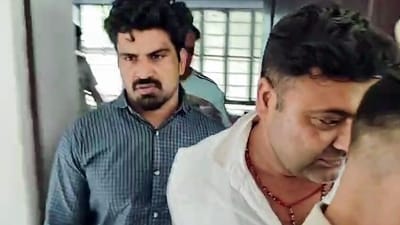 Dausa [Rajasthan], Sep 15 (ANI): The accused driver, Kalyan Bainsla (L), arrested by the Gurugram Police in connection with the hit-and-run case of a female biker on Gurugram's Golf Course Road, in Dausa on Tuesday. (ANI Video Grab) (ANI Video Grab)