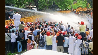 Party turns up heat on AAP govt over Sangrur ‘suicide’, presses for Cheema’s resignation; PPCC chief, Channi share stage after months. (HT PHOTO)