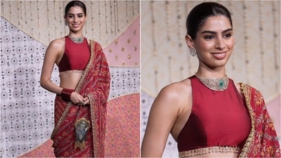 Khushi Kapoor looked stunning in a crimson-red halter-neck blouse paired with a gorgeous embroidered saree and a statement diamond choker necklace. (Instagram)