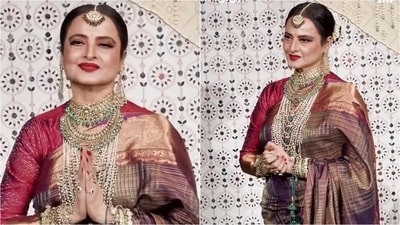 Rekha stunned in a traditional silk saree paired with a full-sleeved red blouse and layered necklaces, exuding timeless regal elegance. (Instagram)