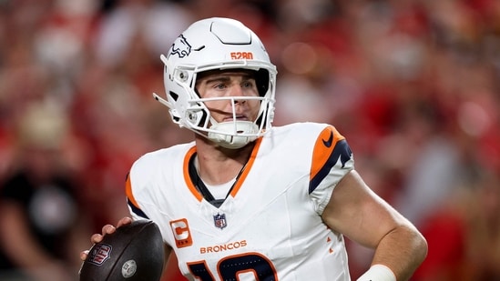 KANSAS CITY, MISSOURI - SEPTEMBER 14: Bo Nix #10 of the Denver Broncos looks to throw a pass against the Kansas City Chiefs during the second quarter in the game at Arrowhead Stadium on September 14, 2026 in Kansas City, Missouri.   Jamie Squire/Getty Images/AFP (Photo by JAMIE SQUIRE / GETTY IMAGES NORTH AMERICA / Getty Images via AFP)