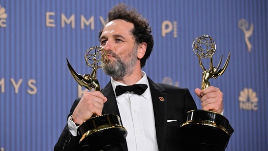Matthew Rhys winner of the awards for Outstanding Lead Actor in a Comedy Series for "Widow's Bay" and Outstanding Lead Actor in a Limited or Anthology Series or Movie for "The Beast in Me" poses in the press room. (Photo by Frederic J. Brown / AFP)
