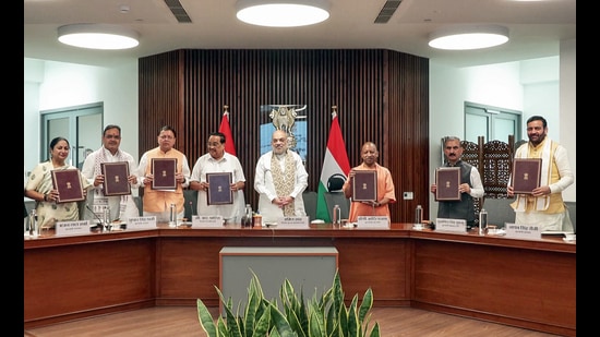 Union home minister Amit Shah, along with (L-R) Delhi CM Rekha Gupta, Rajasthan CM Bhajanlal Sharma, Uttarakhand CM Pushkar Dhami, Union Jal Shakti Minister CR Paatil, Uttar Pradesh CM Yogi Adityanath, Himachal Pradesh CM Sukhvinder Singh Sukhu and Haryana CM Nayab Singh Saini, during the signing of an MoU for the Kishau Multi-Purpose Project, in New Delhi on Tuesday. (ANI Video Grab)