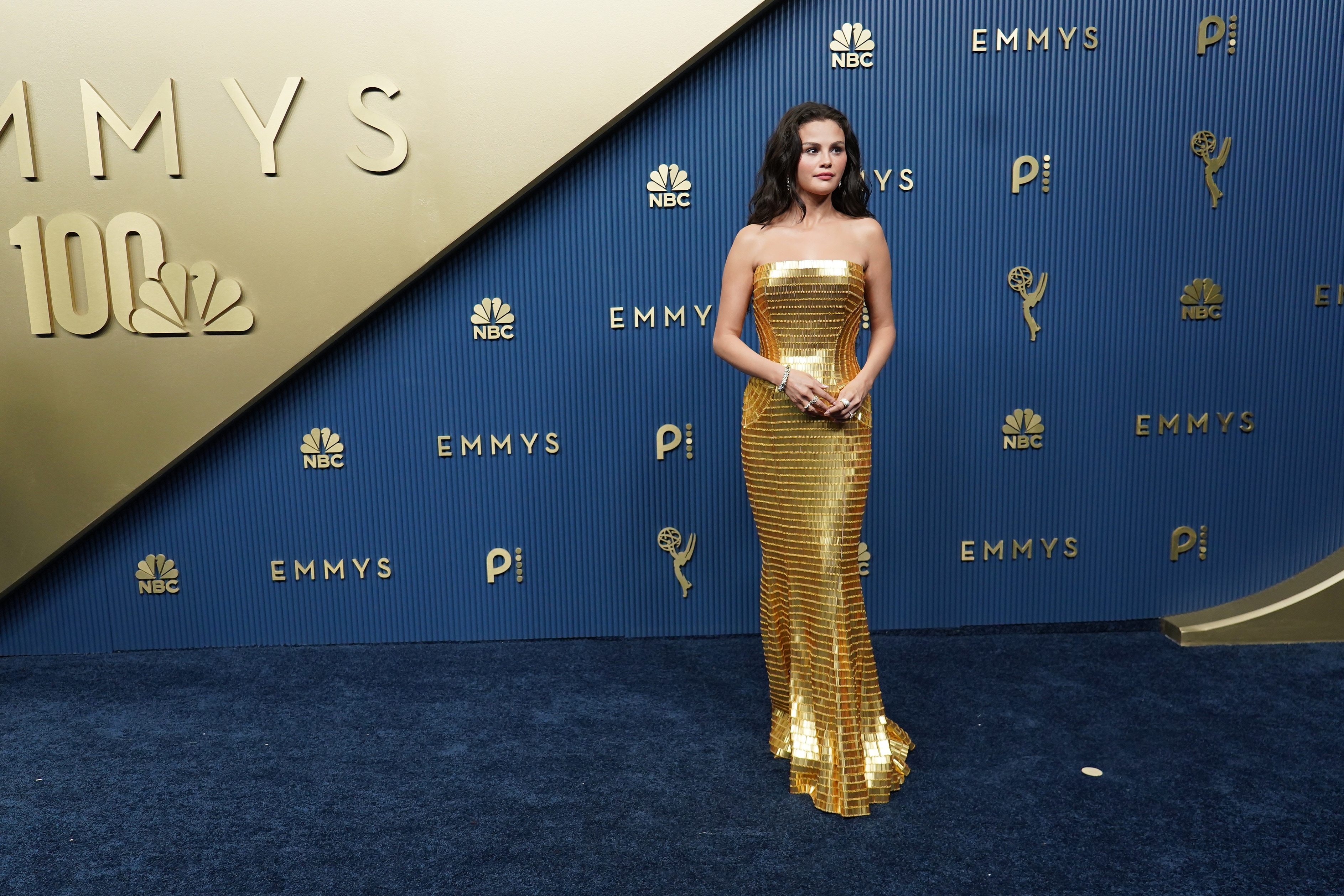 Selena Gomez picked a gold strapless sequin Louis Vuitton gown. (AP) Selena Gomez picked a gold strapless sequin Louis Vuitton gown. (AP)