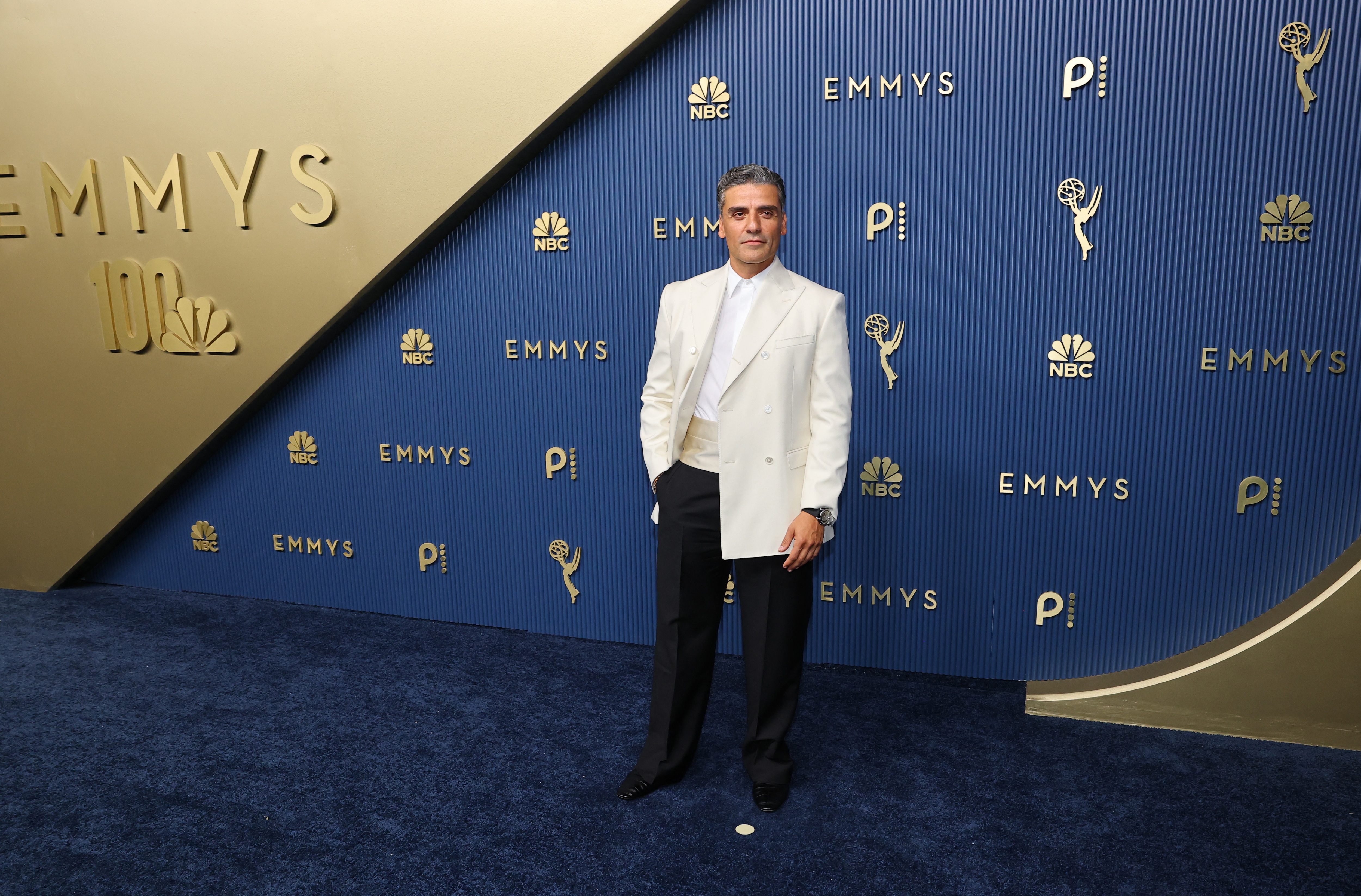 Oscar Isaac sported a cream and black Celine suit. (Reuters)