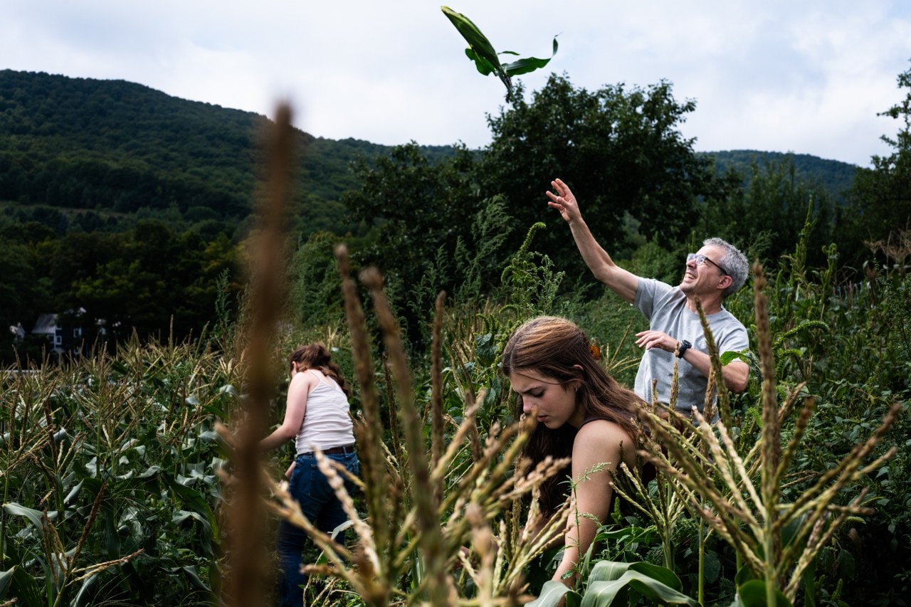 Myers throws an ear of corn while harvesting on Garden Hill. The yield was later served for dinner. Myers throws an ear of corn while harvesting on Garden Hill. The yield was later served for dinner.