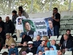 Imran Khan, Pakistan's World Cup winning cricket captain, has been in Adaila Jail over corruption charges. (In picture: Pakistan fans hold a poster of Imran Khan during a cricket match)