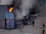 The image provided by KABC-TV shows first responders work the scene after a helicopter crashed near a bus crash in Chatsworth, a neighborhood in Los Angeles.(KABC-TV via AP)