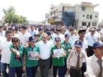 Himachal Pradesh Chief Minister Sukhvinder Singh Sukhu participates in the launch of the second phase of the anti-chitta Walkathon campaign in Una on Wednesday. (HT Photo)