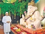 Kiran Shantaram, son of filmmaker V Shantaram, stands beside the Ganapati idol at Rajkamal Studio (Anshuman Poyrekar/HT Photo)