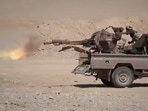 This image shows what the group says are Houthi fighters firing a weapon mounted on a pickup truck during combat with Saudi-backed forces in eastern Jawf, Yemen. 