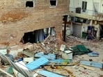 Debris litters the site during the ongoing demolition and clearing operations following a multi-storey building collapse tragedy at Satya Niketan.