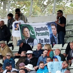 Imran Khan, Pakistan's World Cup winning cricket captain, has been in Adaila Jail over corruption charges. (In picture: Pakistan fans hold a poster of Imran Khan during a cricket match)