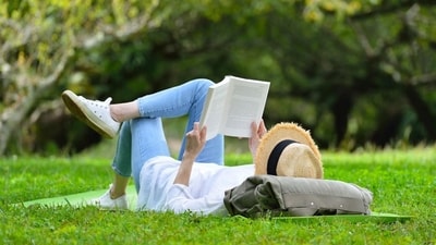 Readers flip open a book, log a minimum 15-minute session on the app, and hit submit. Every 15-minute session earns you 20 virtual coins. (Photo: Adobe Stock) Readers flip open a book, log a minimum 15-minute session on the app, and hit submit. Every 15-minute session earns you 20 virtual coins. (Photo: Adobe Stock)