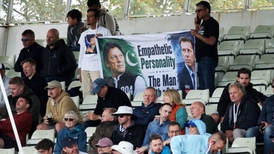 Imran Khan, Pakistan's World Cup winning cricket captain, has been in Adaila Jail over corruption charges. (In picture: Pakistan fans hold a poster of Imran Khan during a cricket match) (Reuters)