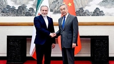 China's foreign minister Wang Yi said Beijing was willing to "safeguard" Iran's rights during talks with his counterpart Abbas Araghchi. (Reuters)
