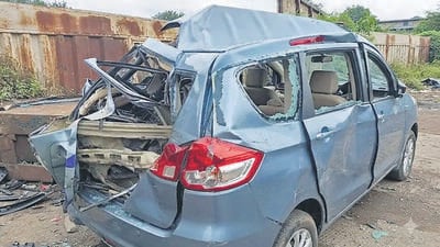 The crushed Maruti Suzuki Ertiga, in which 11 members of the Jaiswal family, including four children, were travelling when the accident occurred on the Mumbai-Nashik Highway near Atgaon in Shahapur. The crushed Maruti Suzuki Ertiga, in which 11 members of the Jaiswal family, including four children, were travelling when the accident occurred on the Mumbai-Nashik Highway near Atgaon in Shahapur.