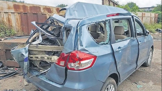 The crushed Maruti Suzuki Ertiga, in which 11 members of the Jaiswal family, including four children, were travelling when the accident occurred on the Mumbai-Nashik Highway near Atgaon in Shahapur.
