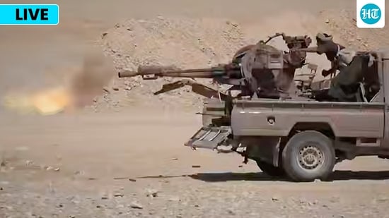 This image shows what the group says are Houthi fighters firing a weapon mounted on a pickup truck during combat with Saudi-backed forces in eastern Jawf, Yemen. This image shows what the group says are Houthi fighters firing a weapon mounted on a pickup truck during combat with Saudi-backed forces in eastern Jawf, Yemen.