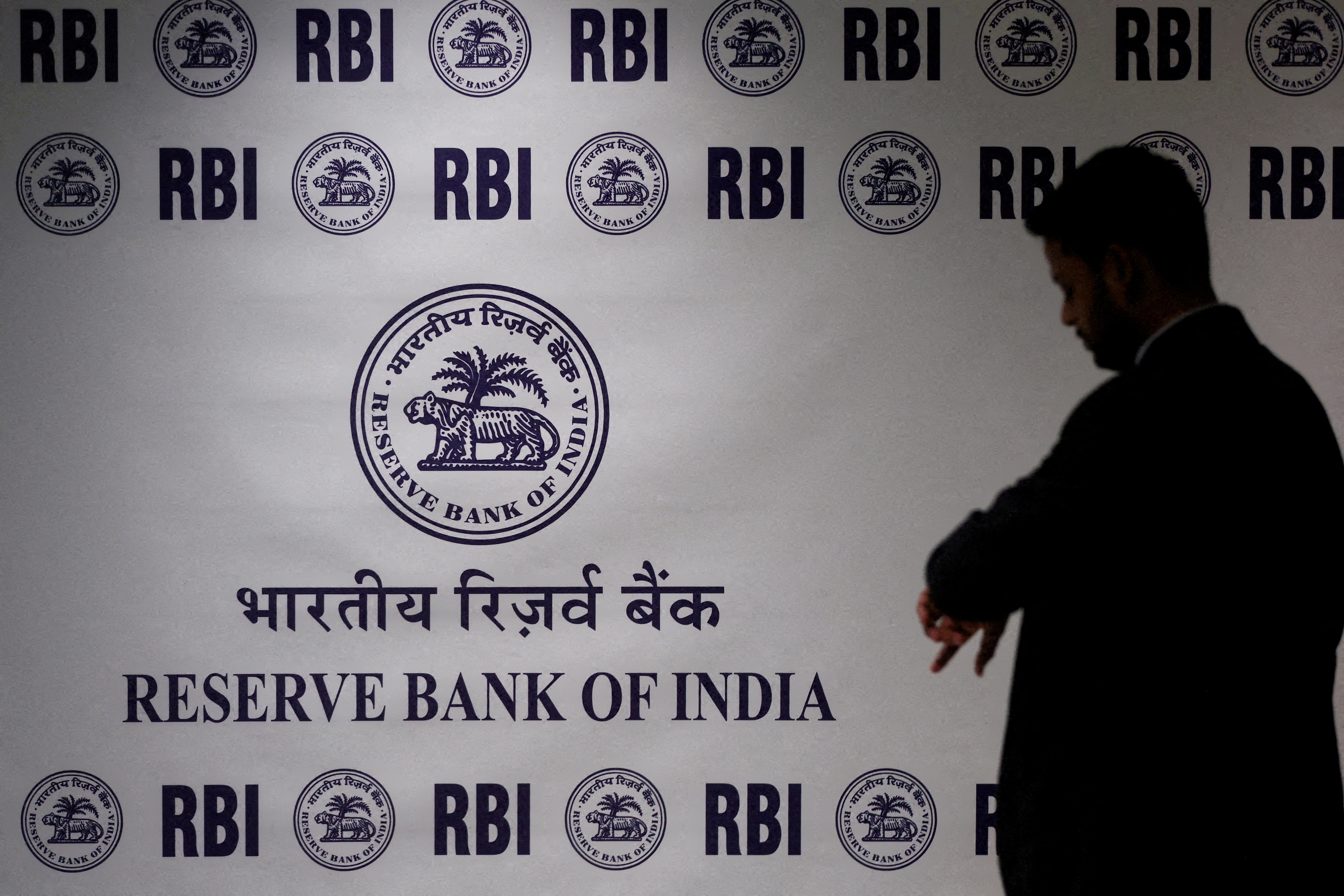FILE PHOTO: A man stands in front of the Reserve Bank of India (RBI) logo inside its headquarters in Mumbai, India, February 6, 2026. REUTERS/Francis Mascarenhas/File Photo (REUTERS)