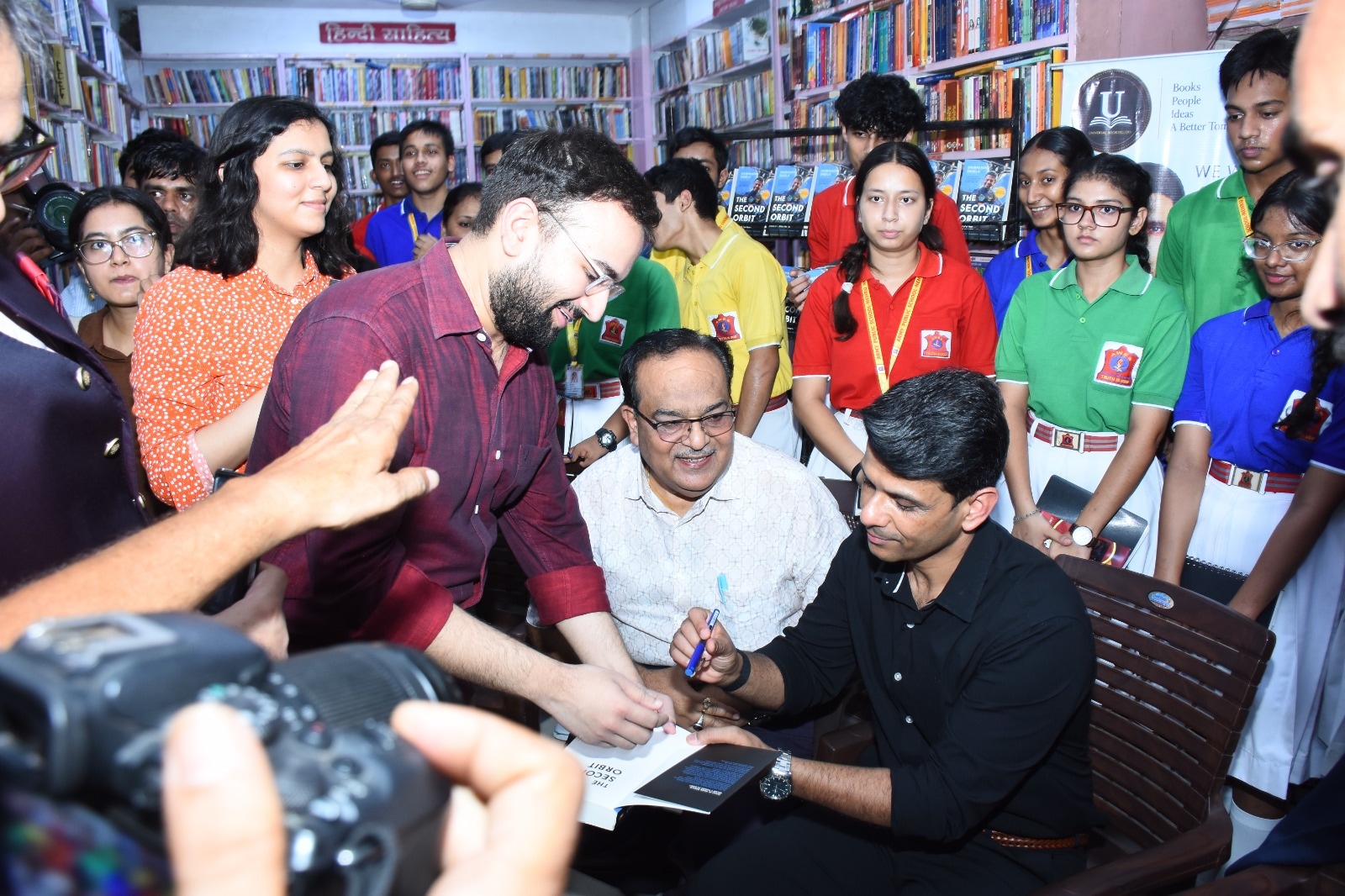 Shubhanshu Shukla during the book signing session Shubhanshu Shukla during the book signing session