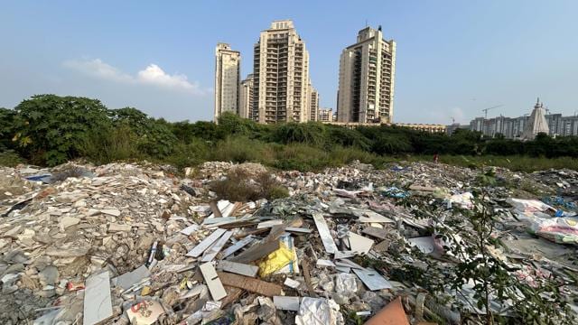 Illegally dumped waste at an empty plot in Sector 109 near Chintels Paradiso society, seen on Tuesday. (PARVEEN KUMAR/HINDUSTAN TIMES) Illegally dumped waste at an empty plot in Sector 109 near Chintels Paradiso society, seen on Tuesday. (PARVEEN KUMAR/HINDUSTAN TIMES)