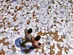 A large number of pamphlets lie scattered across a road at Delhi University's North Campus in New Delhi on Wednesday. (Sanchit Khanna/Hindustan Times)