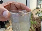 A resident shows a glass of contaminated water on Wednesday. (Gurpreet Singh/HT)