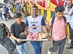 Carried on a plank, Amit Shiwalkar travels from Govandi to Lalbaug every year to seek Bappa’s blessings.