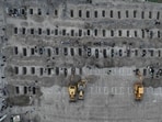 Graves prepared for the victims of the strike on a school in Minab, Iran.