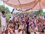 Kisan Mazdoor Morcha (KMM) activists raising slogans against the state government while blocking the Amritsar-New Delhi railway track at Devidaspura village near Jandiala Guru on Thursday. (Sameer Sehgal/HT)