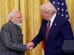 US President Donald Trump and Prime Minister Narendra Modi shake hands as they attend a joint press conference at the White House in Washington.