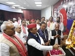SP chief Akhilesh Yadav and others during Vishwakarma Puja at the party headquarters in Lucknow on Thursday. (HT)