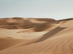From tales of music by ghosts to scientific inquiry, the phenomenon of singing sands intrigues researchers. Investigations show how specific dune characteristics influence sound production, linking ancient mysteries to granular mechanics and acoustics, revealing why only some dunes resonate.