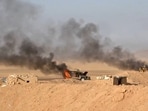 This handout picture reportedly shows burning military vehicles that the Houthis targeted in al-Jawf. 