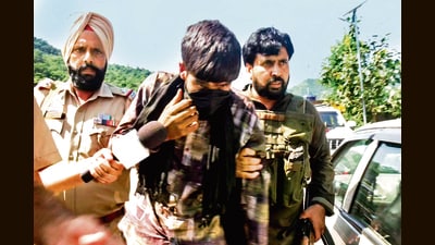 A man, said to be overground worker, being detained by security forces in in Udhampur on Thursday. (ANI) A man, said to be overground worker, being detained by security forces in in Udhampur on Thursday. (ANI)