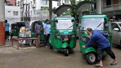 An autorickshaw driver pulls his vehicle after filling it with CNG at a fuel station amid fuel shortage, in Dhaka, Bangladesh, August 26, 2026. (REUTERS)