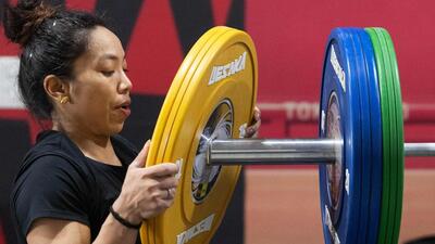 Mirabai Chanu trains for the Asian Games at coach Vijay Sharma’s academy in Modinagar. (AFP) Mirabai Chanu trains for the Asian Games at coach Vijay Sharma’s academy in Modinagar. (AFP)