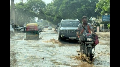 Pumping provides only temporary relief, residents say, as stagnant water damages RMC roads and forces vendors onto footpaths around the busy intersection. (HT)