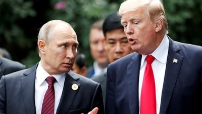 President Donald Trump and Russia's President Vladimir Putin talk during the APEC Summit in Danang. (REUTERS/File)